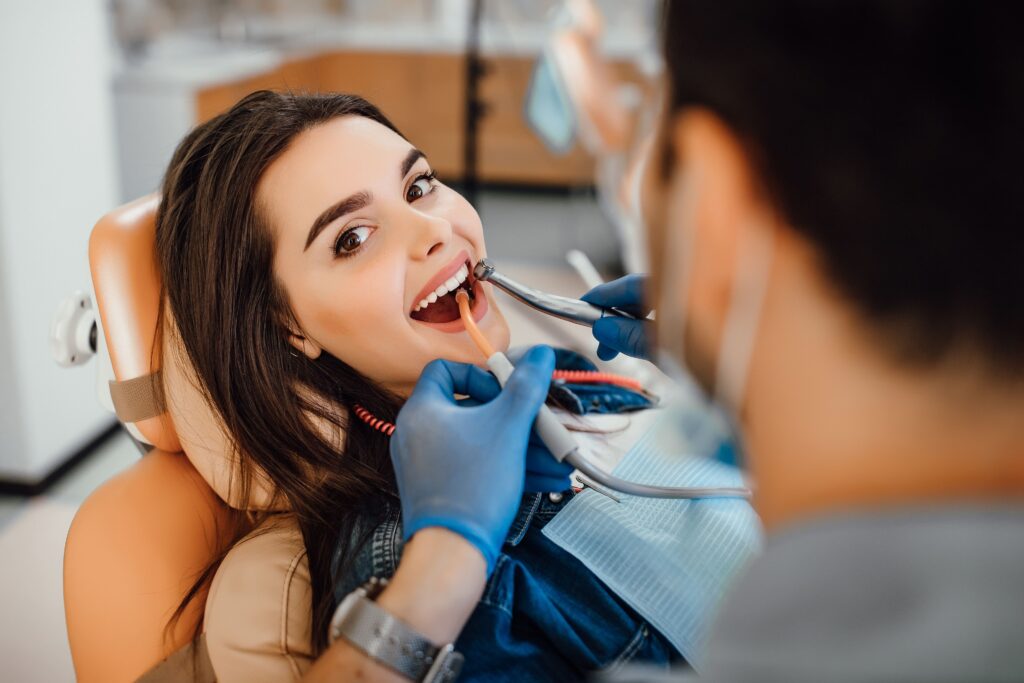 young-female-patient-visiting-dentist-office-min